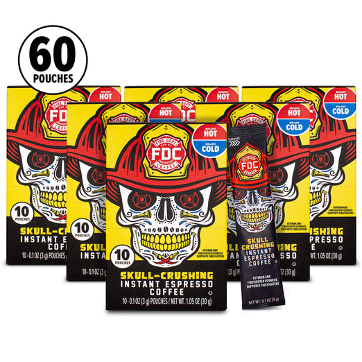 Five FDC Skull-Crushing Instant Espresso Coffee pouches arranged in a fan on a white background, with a black circular badge in the top left reading 60 Pouches. The packaging features a skull wearing a red firefighter hat and a red hot/cold indicator badge.