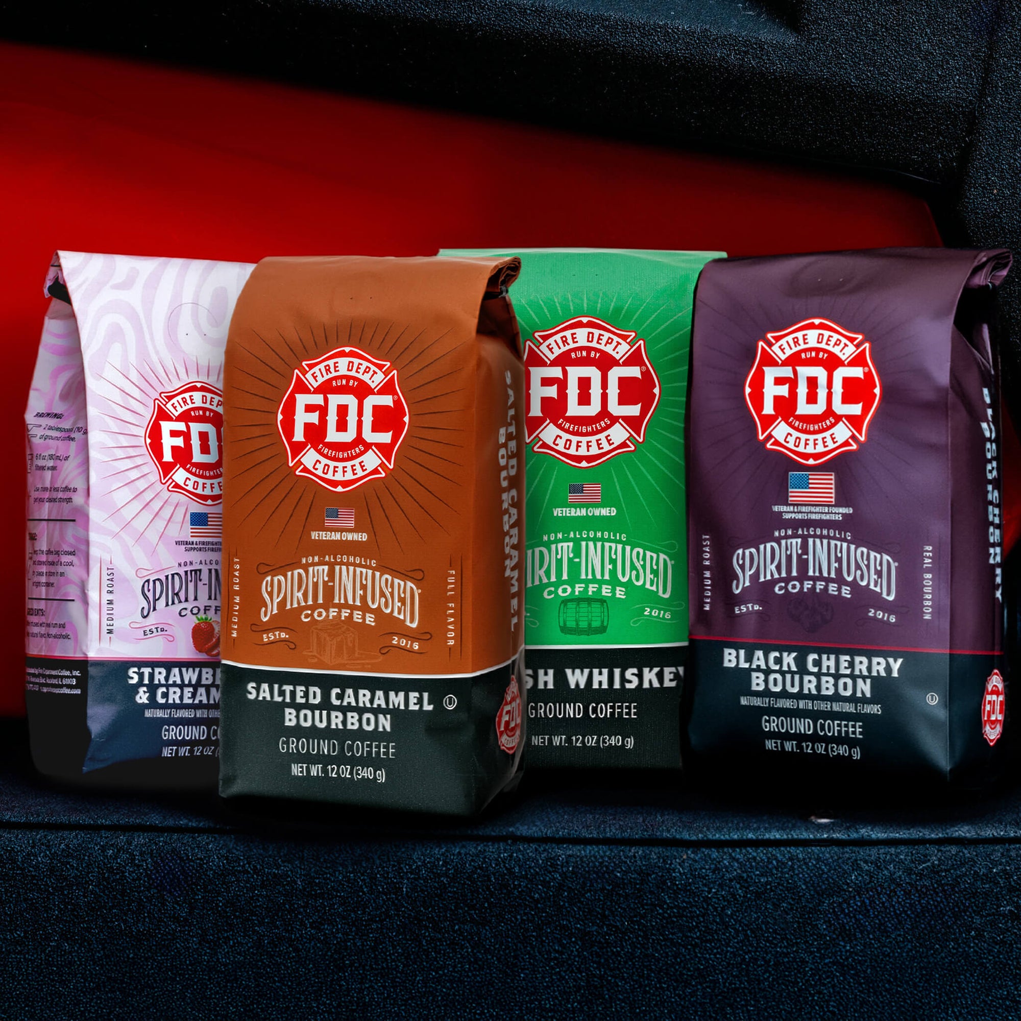 Four Spirit Infused Coffee bags from FDC Coffee on a white background