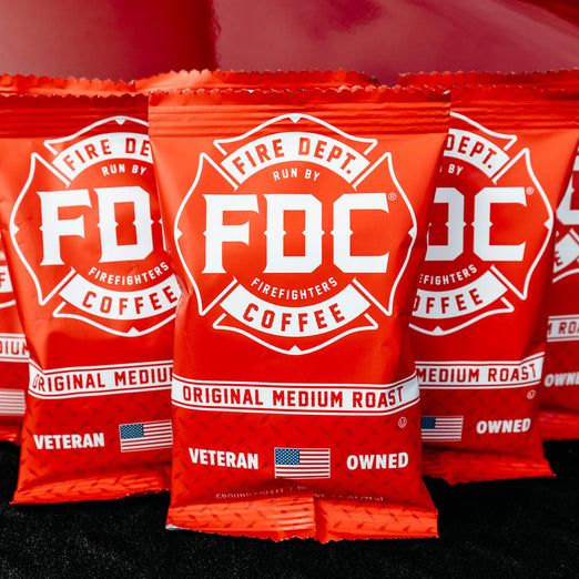 An image of multiple Frac Packs resting on the edge of a fire truck.