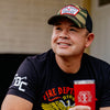 A front angle image of a man wearing the Fire Department Coffee Camo Keystone Hat