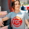 A woman wearing the Fire Department Coffee Gray Shirt
