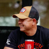 A 3/4 Angle image of a man wearing the Fire Department Coffee Tan Keystone Hat