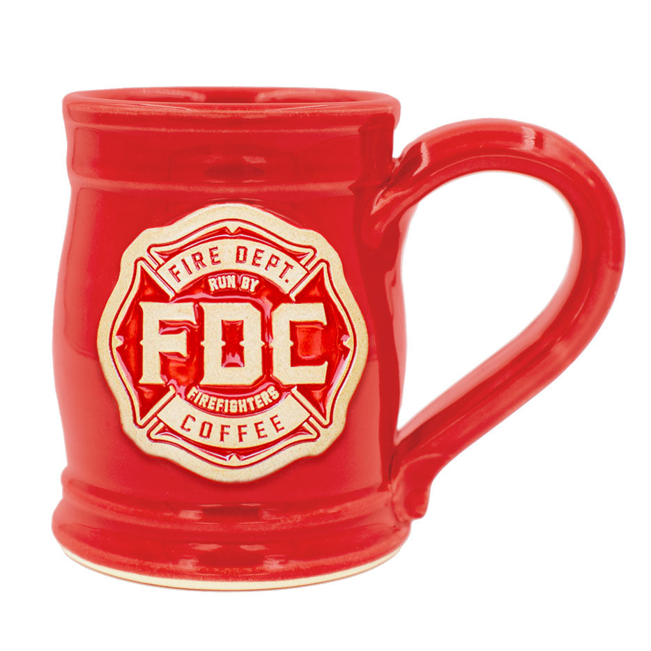 A red pottery mug with the Fire Department Coffee maltese cross logo centered on the mug.