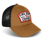 Tan hat with black mesh back and a Fire Department Coffee keystone patch on the front
