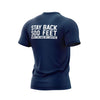 Back side of navy blue t shirt with large white lettering that reads ”Stay back 500 feet until I’ve had my coffee” across the top