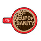 Sticker with top view of a red mug with coffee inside with bubbles that read ”cup of sanity”. FDC pike pole logo is on the handle in white. 