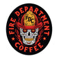 Sticker with a skull wearing an FDC fire helmet surrounded by flames in the center. Around the skull is text that reads ”Fire Department Coffee”.