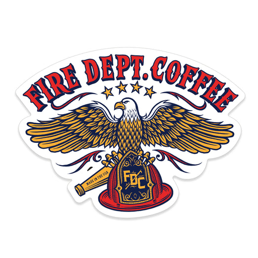 A sticker with an illustration of an eagle holding an FDC fire helmet. Above the eagle is red text that reads ”Fire Dept. Coffee”