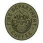 Olive green sticker with ”Fire Department Coffee��� around the edge of the oval. There is a skull in the middle wearing a firefighting helmet