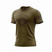 Green shirt with a skull wearing an FDC helmet. Around the skull is the text ”Fire Department Coffee”. There is an FDC maltese cross logo on the sleeve.